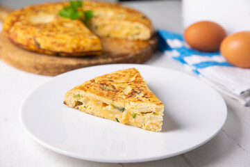 Traditional Spanish omelette with potatoes and zuuchini