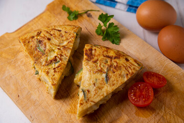 Traditional Spanish omelette with potatoes and zuuchini