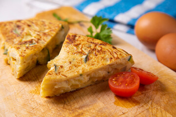 Traditional Spanish omelette with potatoes and zuuchini