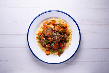 Marinated chicken with vegetables and cuscus