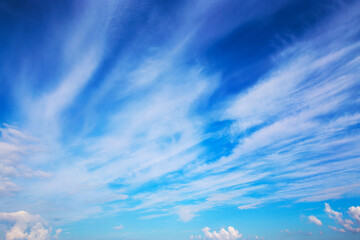 Naklejka na ściany i meble The puffy white cloud in the blue sky.
