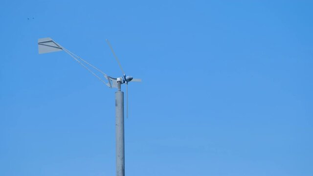 Wind turbine energy, sustainable generator alternative blue clear sky background