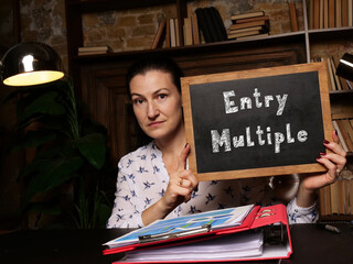 Financial concept about Entry Multiple with sign on black chalkboard.