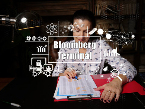 Financial Concept About Bloomberg Terminal With Young Businesswoman Working Office On Background.