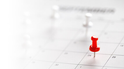 Calendar page pinned in a calender on datebusiness meeting schedule, travel planning or project milestone and reminder concept.