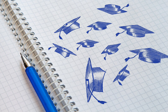 University graduates throwing academic caps up. Graduation day. Happy students graduates toss up caps. Congratulation graduates. Hand drawn illustration on sheet of notebook.