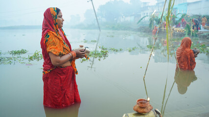 Women worshipping during chhath festival 