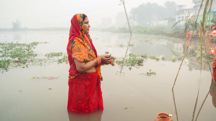 Portrait of woman worshipping during chhath festival 