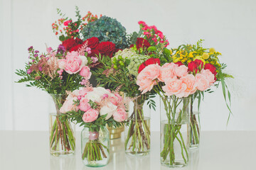 Colorful bouquets of flowers on white background