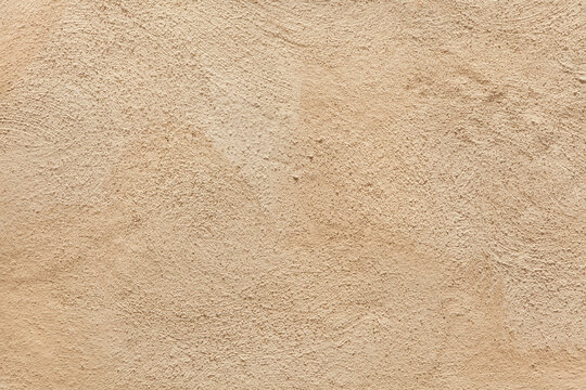 Beige painted stucco wall.