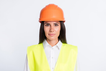 Photo of charming calm business lady look camera wear helmet shirt vest isolated white color background