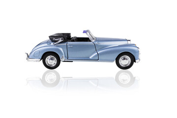 Fototapeta na wymiar Blue toy convertible car side view, isolated on white background.