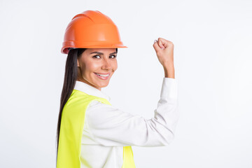 Photo of powerful lady raise hand show biceps shiny smile wear helmet shirt vest isolated white color background