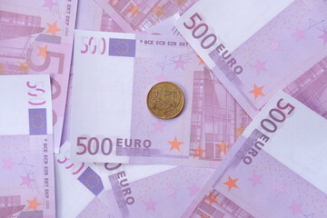 euro banknotes and coins on white