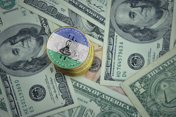 golden shining bitcoins with flag of lesotho on a dollar money background.