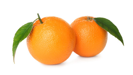 Fresh ripe oranges with green leaves on white background