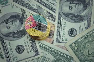 golden shining bitcoins with flag of mozambique on a dollar money background.