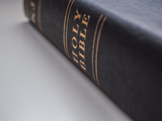 Black holy bible with white background and copy space