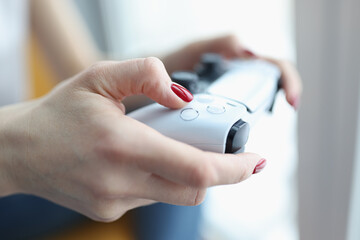 Woman playing computer game with joystick closeup. Entertainment and leisure concept © H_Ko