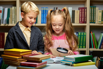 boy and girl reading book in school library, people lifestyles and friend Education and friendship...