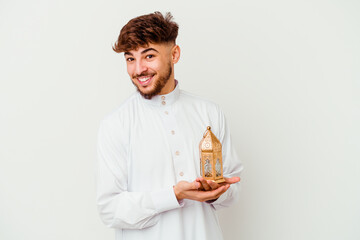 Young Moroccan man wearing a typical arab clothes holding a ramadan lamp isolated on white...