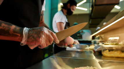 Chefs are cooking in the kitchen in a restaurant