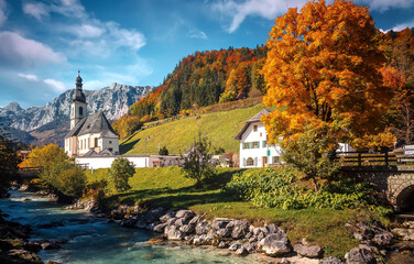 Scenic image of nature landscape. Wonderful sunny autumn scenery in Bavarian Alps. famous Parish Church of St. Sebastian in Ramsau in falltime, Nationalpark Berchtesgadener Land,  Bavaria, Germany