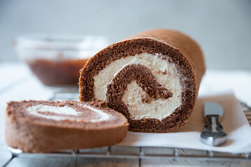 Sweet roll with wiped cream, delicious chocolate cake