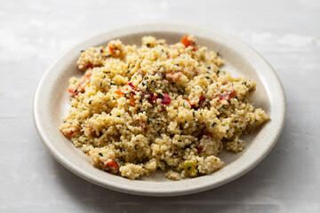 tabbouleh on small plate on ceramic background