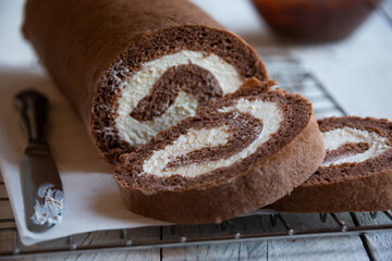 Sweet roll with wiped cream, delicious chocolate cake