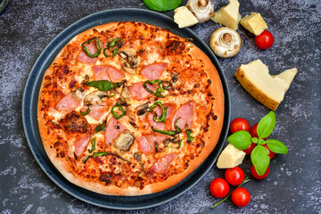 Tasty hot italian carbonara pizza with ham, bechamel sauce,mushroom,tomatoes  and cheese. Pizzeria menu. Concept poster for Restaurants or pizzerias. Top view,dark  background