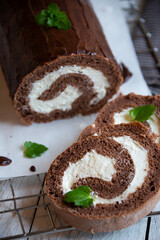 Sweet roll with wiped cream, delicious chocolate cake