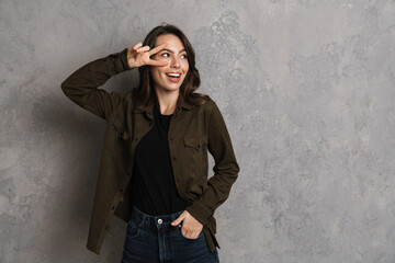 Portrait of happy smiling woman in casual wear standing