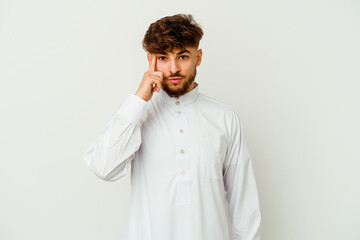 Young Moroccan man wearing a typical arab clothes isolated on white background pointing temple with finger, thinking, focused on a task.
