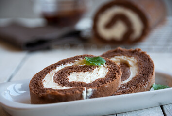 Sweet roll with wiped cream, delicious chocolate cake