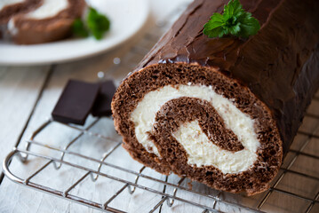 Sweet roll with wiped cream, delicious chocolate cake