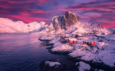 Amazing evening on Lofoten. Scenic photo of winter mountains and vivid colorful sky. stunning natural background. Picturesque Scenery of Reinefjord one most popular place of Lofoten islands. Norway