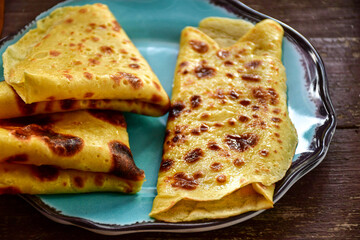 Bakery. Home made pancakes with   organic eggs and white cheese on wooden background. Rustic style breakfast