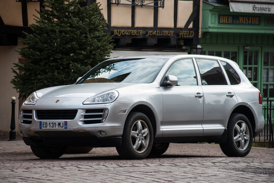 Colmar - France - 7 March 2021 - Front view of grey Porsche Cayenne SUV sport car parked in reet