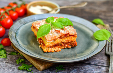 Home made italian lasagna pasta  bolgonese with tomato sauce and basil