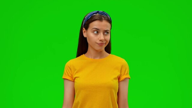 Beautiful girl not knowing information, shrugs shoulders and raises hand. Alpha channel