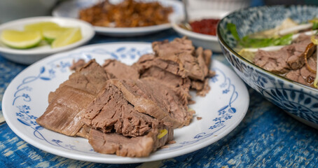Slices of boiled beef on a plate. Selective focus. - 419119337