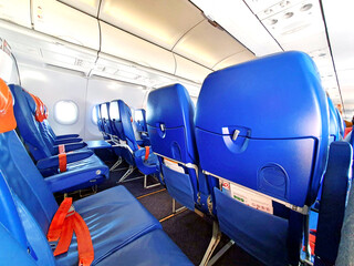 Empty seats, empty seats on board in the cabin of the aircraft	
