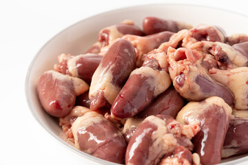Fresh raw chicken heart on pure white background