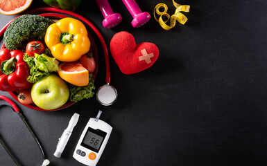 World health day and medical concept. Top view of healthy food in plate with stethoscope, red heart...