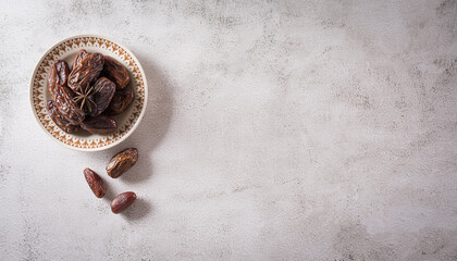 Ramadan food and drinks concept. Dates fruits on dark stone background.