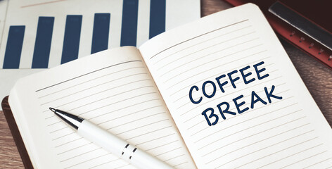 The words Coffee Break written on a white notebook. Work and study concept