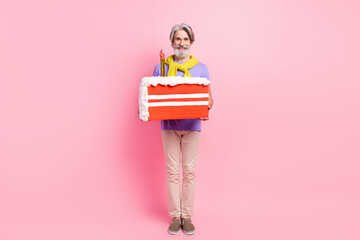 Photo of aged man happy positive smile hold big slice cake birthday tied sweater isolated over...