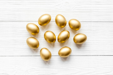 Golden eggs. Easter decoration background. Top view