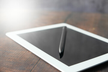  digital tablet with graphic pen on table 